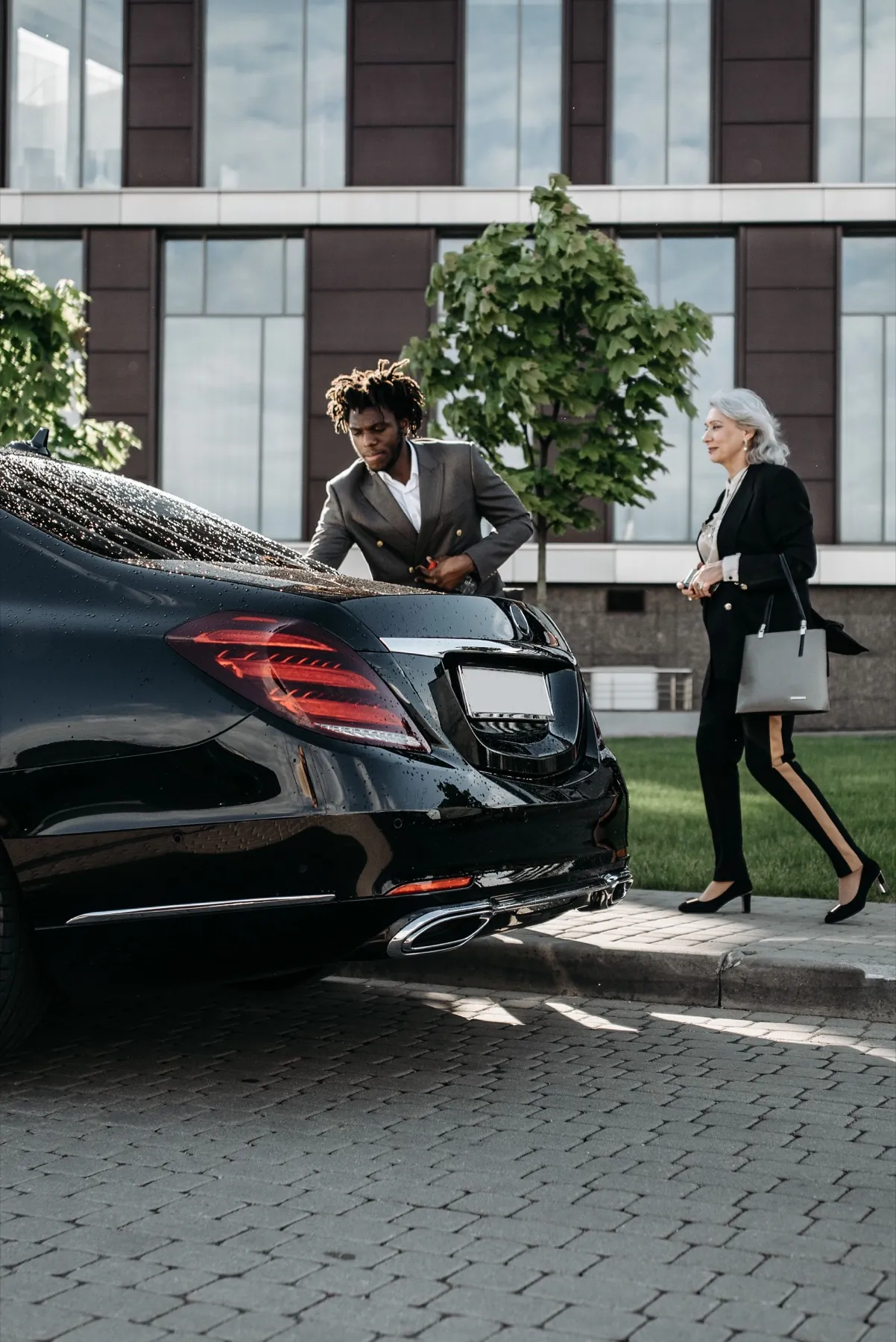 Chauffeur helping a passenger to a medical appointment