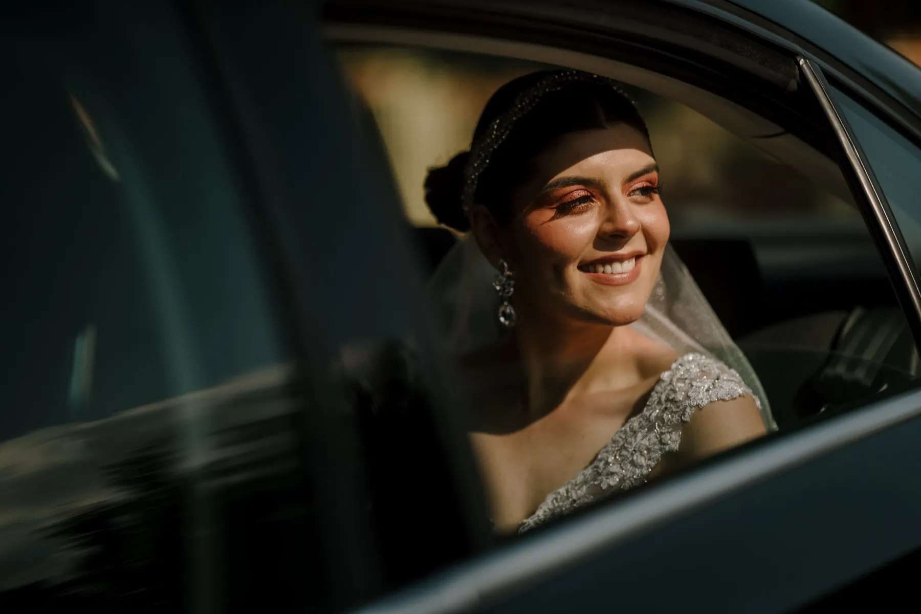 Wedding couple arriving by chauffeured car